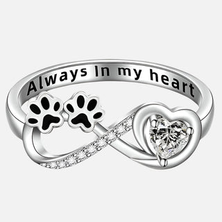 Ring with zirconia in the shape of a paw with a design in the form of a heart and infinity